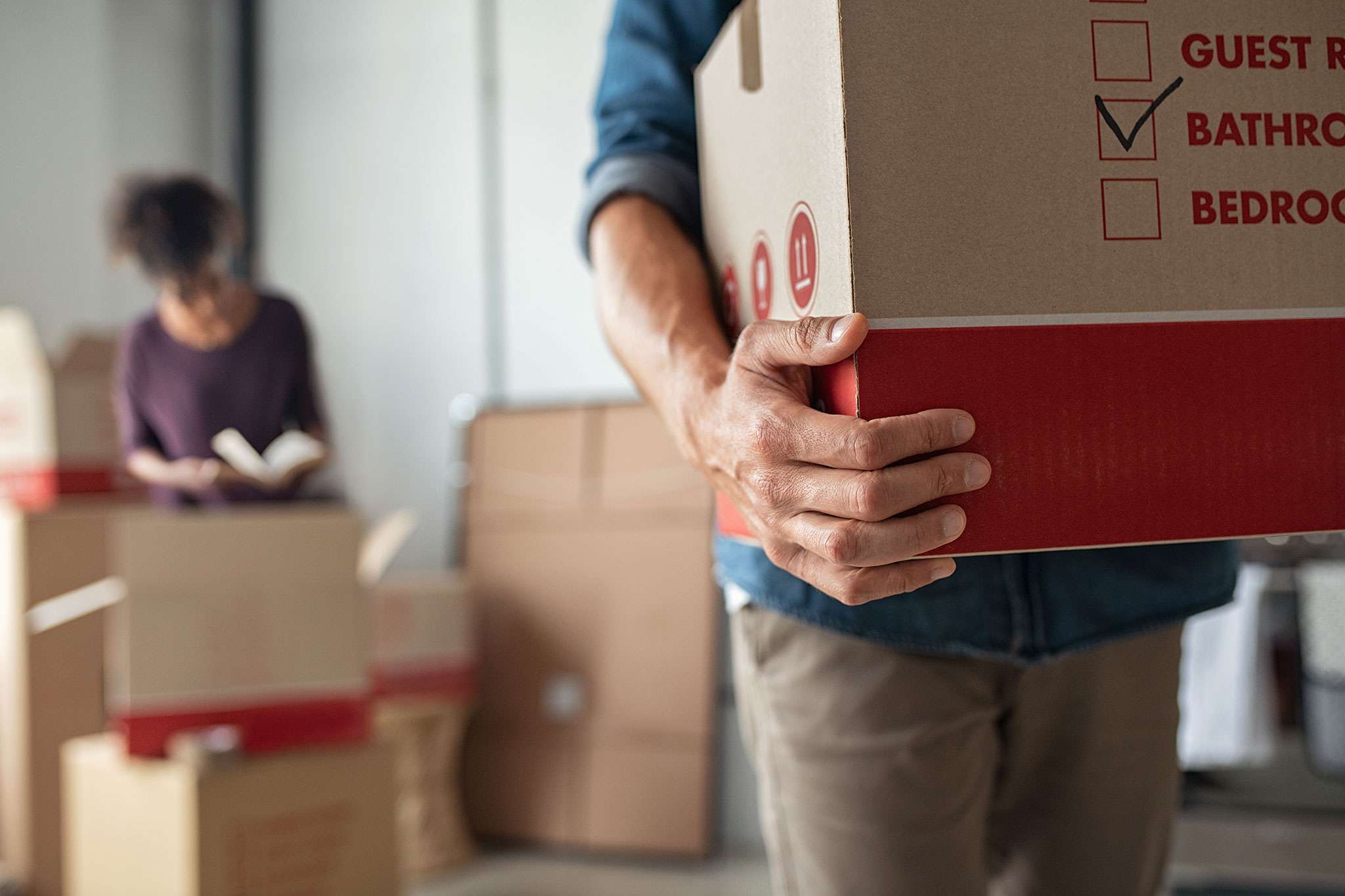 man leaving with a moving box