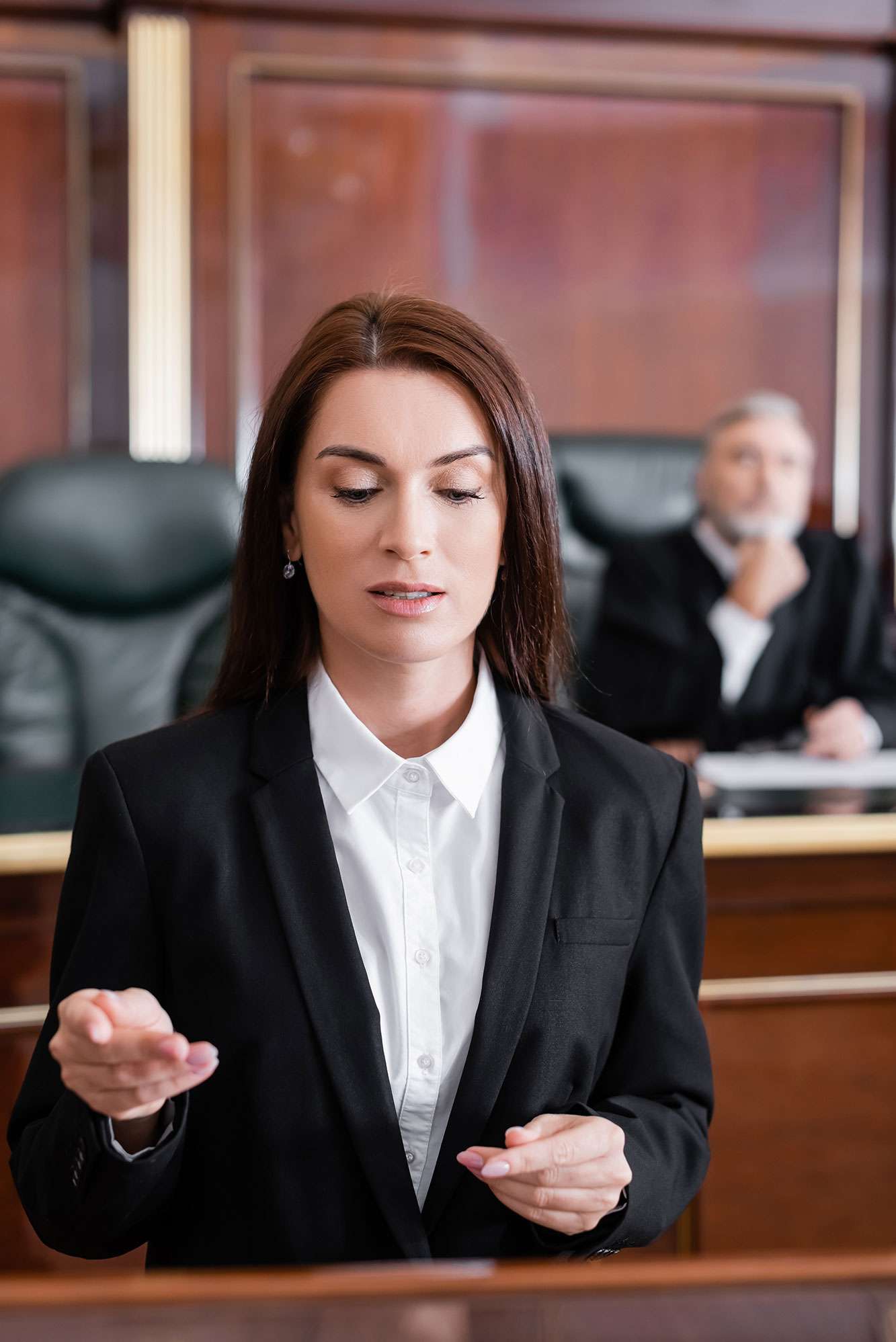 Female lawyer in court room during litigation
